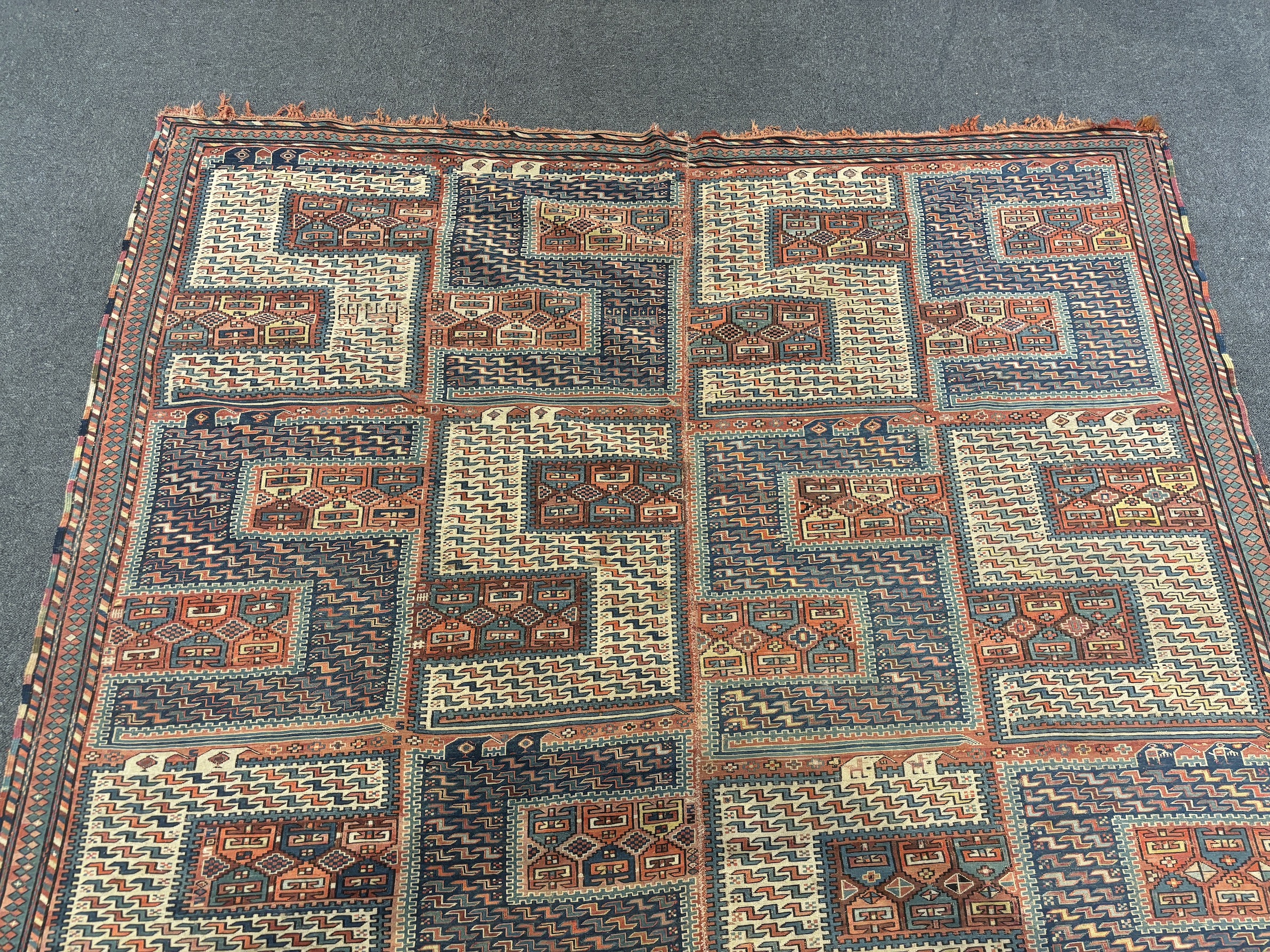 An antique Caucasian geometric rug, 255 x 210cm